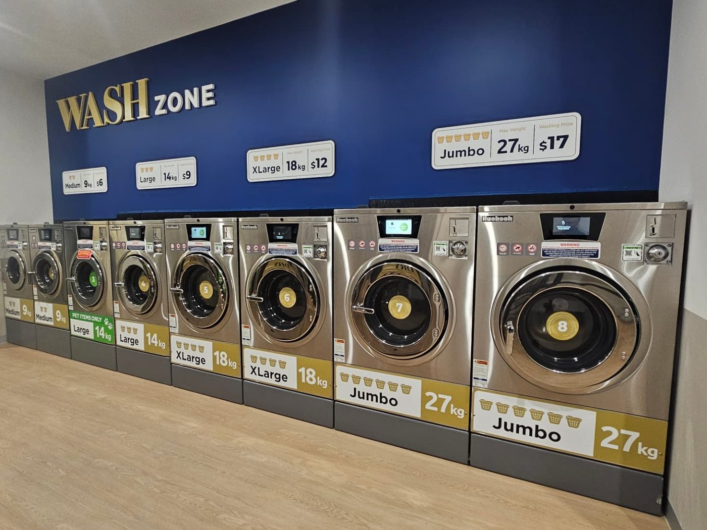 The LuxeSpin Wash Zone in Officer with 9 kg, 14 kg, 18 kg and 27 kg commercial washers