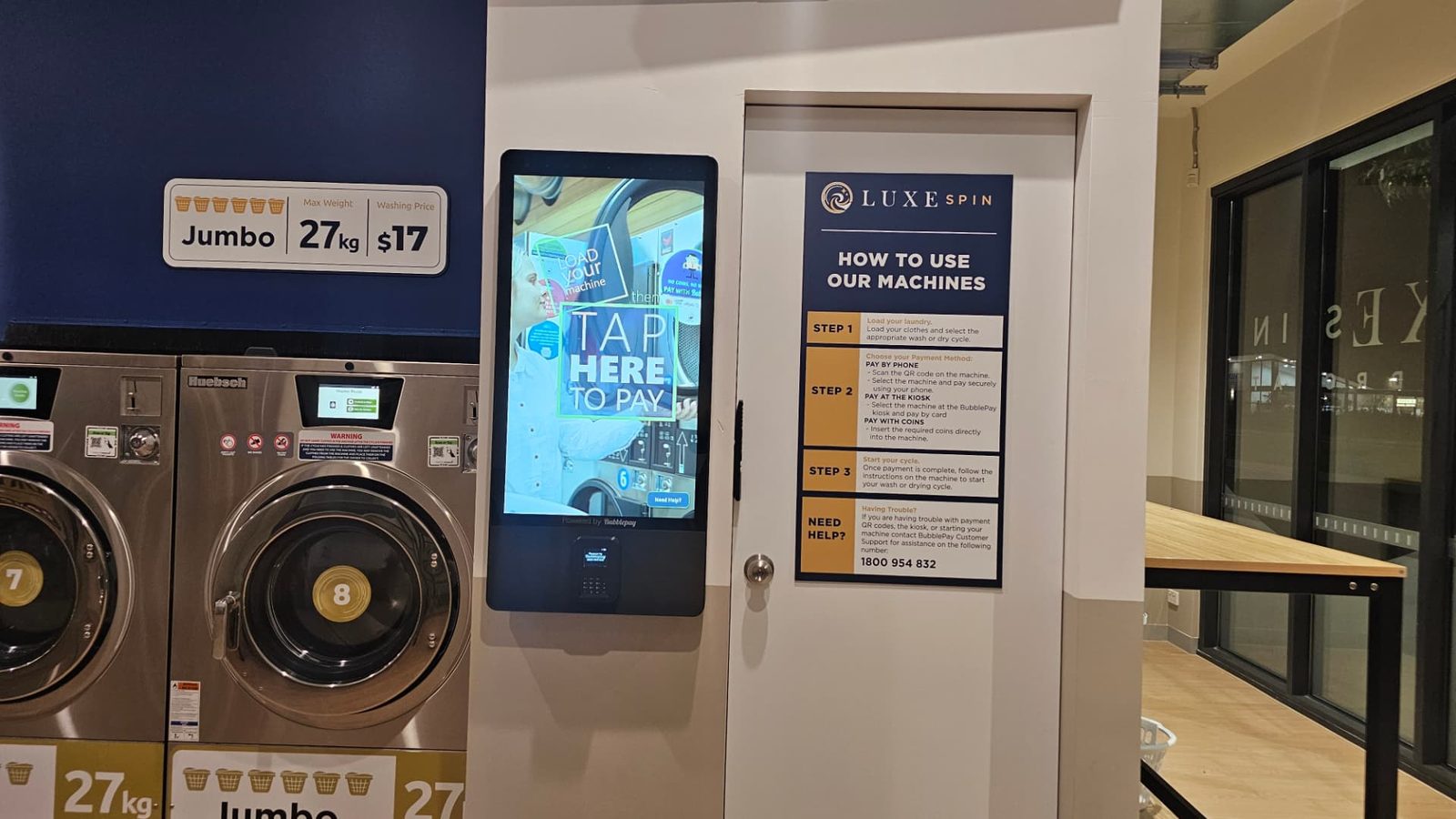 The LuxeSpin payment kiosk beside the How to use our machines instructions